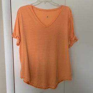 Lululemon orange striped flowy t-shirt.